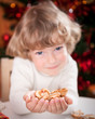 © Sunny studio - Happy child holding cookies