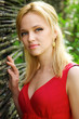 © Sergios - Young beautiful blonde woman in a red dress