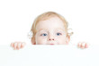 © Andrey Kuzmin - Curly cute child holding blank advertising banner