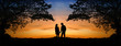 The image of two romantic people in love standing at the sunset