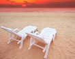 couples of white chairs beach and sun set dusky time