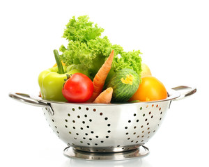 fresh vegetables in silver colander isolated on white