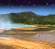 Landscape and Geysers of Yellowstone National Park at Night