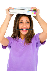 Wall Mural - teenage girl with pencil in mouth and books