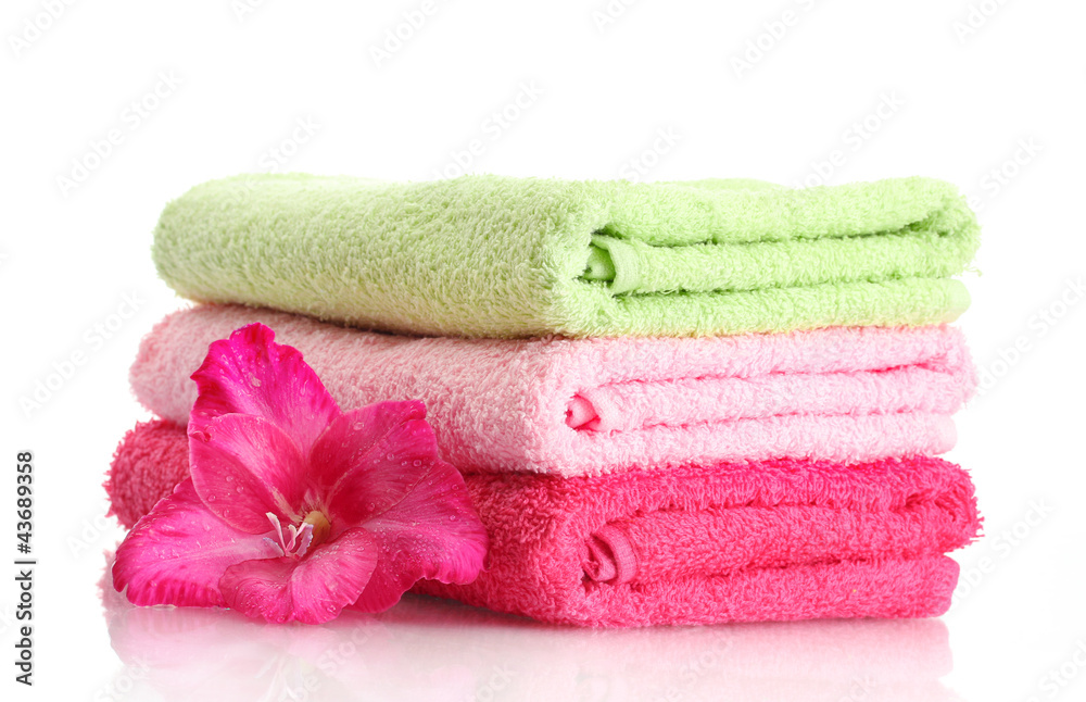 bright towels and flower isolated on white