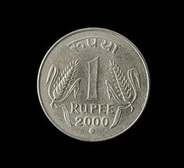 one indian rupee isolated on black background