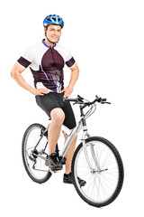 Wall Mural - Full length portrait of a smiling bicyclist posing on a bicycle