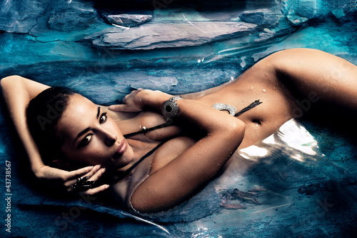 Fototapeta na wymiar sensual woman in natural pool