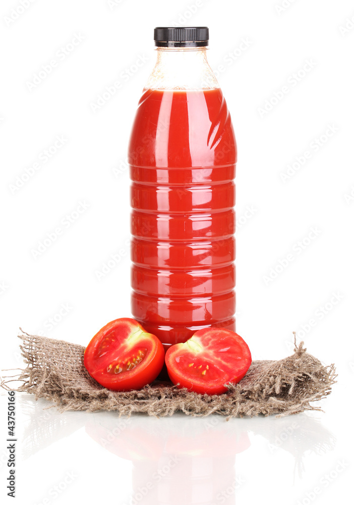 Tomato juice in bottle on sackcloth isolated on white