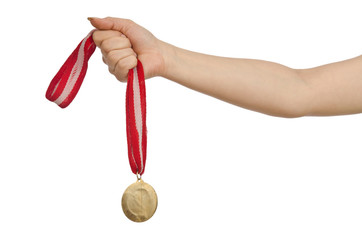 Wall Mural - hand holding gold medal on white