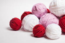 A Group Of Multi-colored Balls Of Yarn