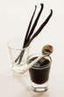 Vanilla beans and cup with extract