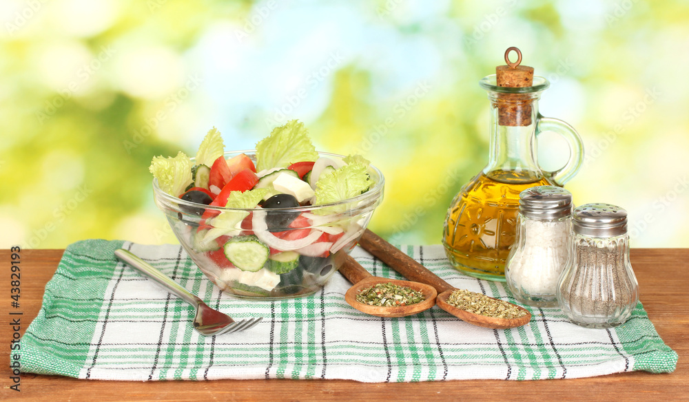 tasty greek salad on bright green background