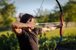 © lightpoet - Young archer training with the  bow