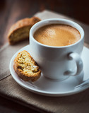 Fototapeta Boho - Cup of espresso coffee with cantuccini