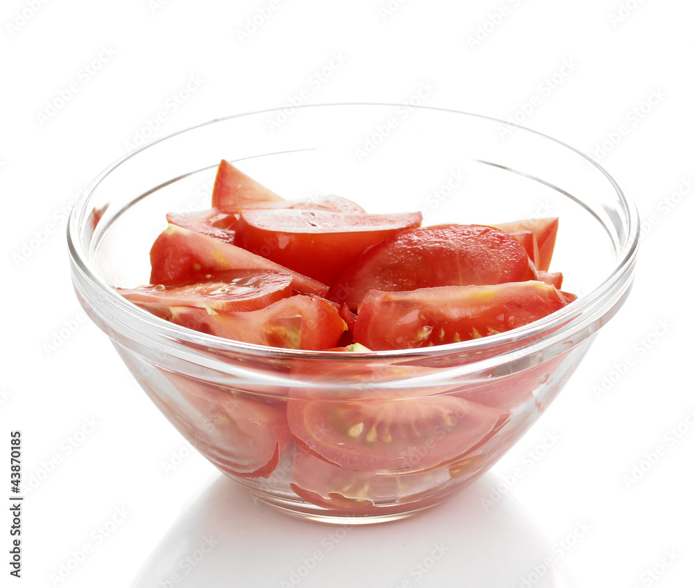 Diced tomatoes in glass bowl isolated on white