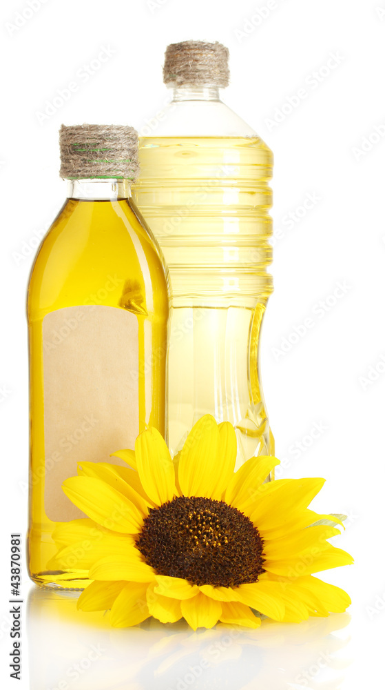 oil in jars and sunflower, isolated on white
