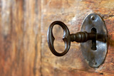 Fototapeta Uliczki - Closeup of an old keyhole with key