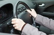 © Kekyalyaynen - Right hands position on steering wheel during driving a car