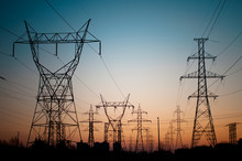 Electrical Transmission Towers (Electricity Pylons) At Sunset