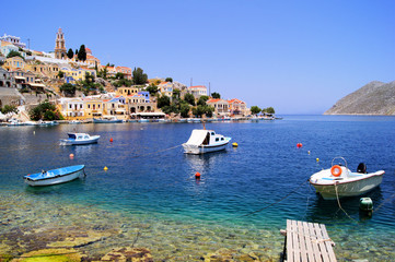 Wall Mural - Colorful harbor district of the town of Symi, Greece