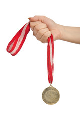 Wall Mural - hand holding gold medal on white