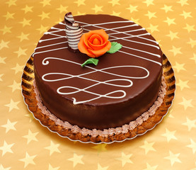 Wall Mural - Chocolate cake on golden stars background