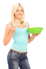 Poster - Young woman eating a salad