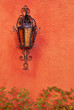 Old lamp on terracotta wall