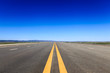 highway in steppe against a blue sky