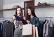 © Karramba Production - Two young attractive girlfriends go shopping