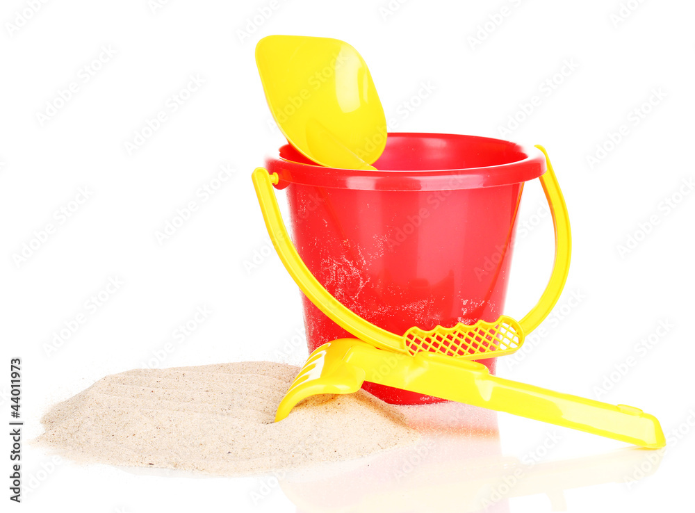 Children's beach toys and sand isolated on white