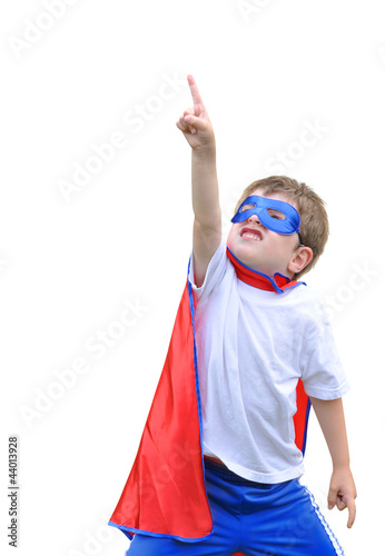 Fotografering Super Hero Boy Pointing on White Background