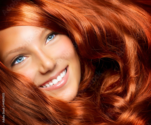 Naklejka na drzwi Beautiful Girl With Healthy Long Red Curly Hair