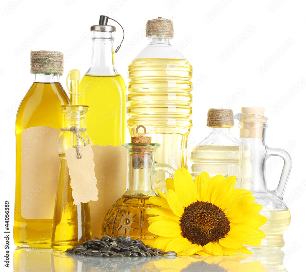 oil in bottles, sunflower and seeds, isolated on white