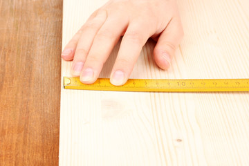 Canvas Print - measuring wooden board close-up