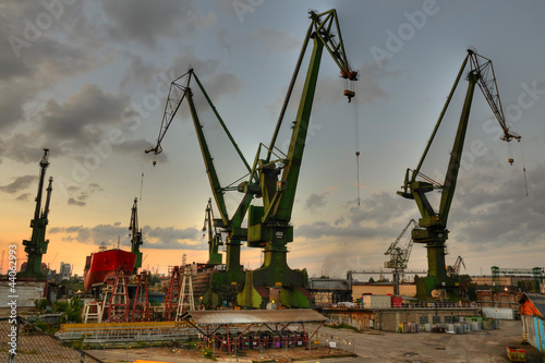 Cuadros en Lienzo Gdansk shipyard cranes at summer evening
