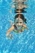 © Iuliia Sokolovska - Happy smiling underwater child in swimming pool, summer vacation