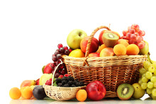 Assortment Of Exotic Fruits And Berries In Baskets Isolated