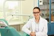 © shefkate - woman dentist at her office smiling