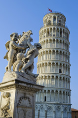 Leaning Tower and Angels statue in Piazza dei Miracoli in Pisa