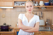 © listercz - Beautiful relaxed woman standing at the kitchen counter