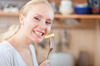 © listercz - Woman tasting cooked macaroni in the kitchen, mac and cheese