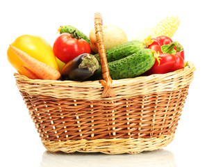 Wall Mural - Fresh vegetables in basket isolated on white