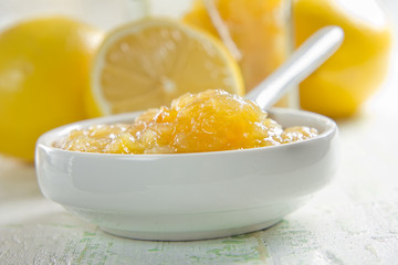 Sticker - homemade lemon jam in a china bowl with spoon and fresh fruits