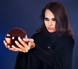 Woman holding crystal ball.