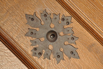 Wall Mural - Steel ornament on wooden door