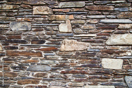 Fototapeta mur mur-z-nierownymi-kamieniami