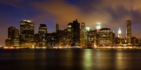 Wall Mural - Manhattan skyline by night from Brooklyn bridge park