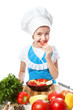 © Natalya Antoshchenko - Happy little chef cook tastes salad with Bell Pepper